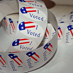 voted-stickers500x250 roll of colorful "Voted" Stickers on a table