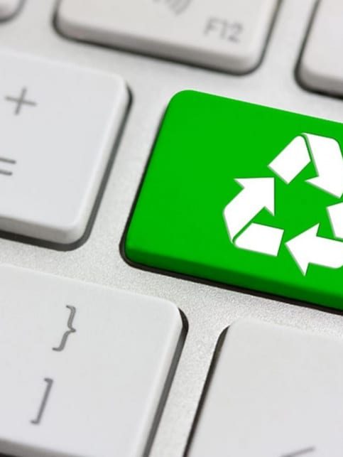 Green Recycling Symbol on Keyboard