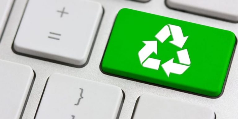 Green Recycling Symbol on Keyboard