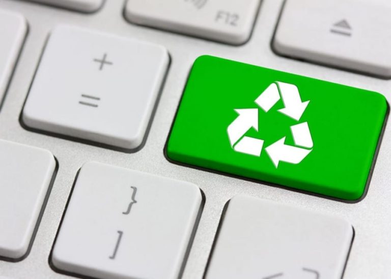 Green Recycling Symbol on Keyboard