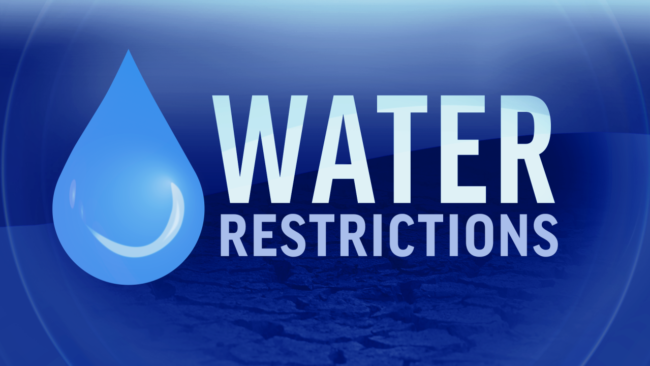 2023 Water Restrictions Blue sign showing water droplet